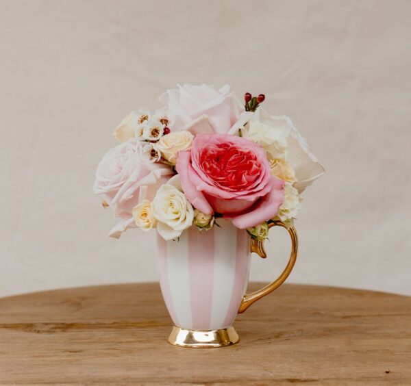 Christina Re teacup posy with fresh pink and white roses