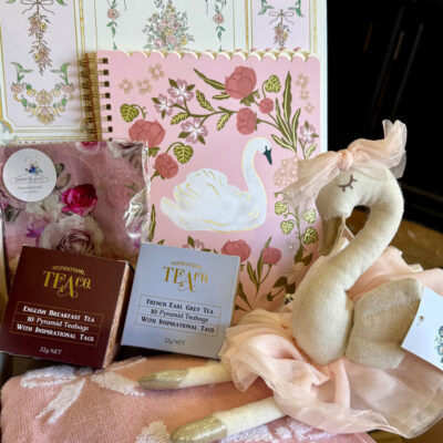 A heartfelt mother and baby hamper from Mayflowers Florist Newcastle. Includes a swan toy, bow towel, tea, silk handkerchief and more.