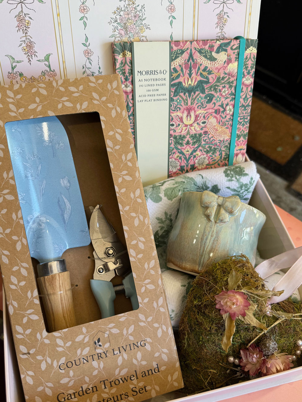 A beautiful garden-themed mothers day hamper from Mayflowers Florist Newcastle. Includes quality tools, pottery and more.