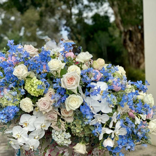 funeral-flowers-casket-newcastle-blue custom funeral flowers for coffin in blues and whites
